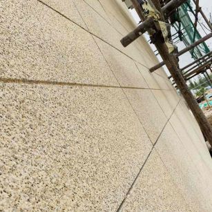 商丘 黄金麻花岗岩荔枝面外墙干挂石材效果示例