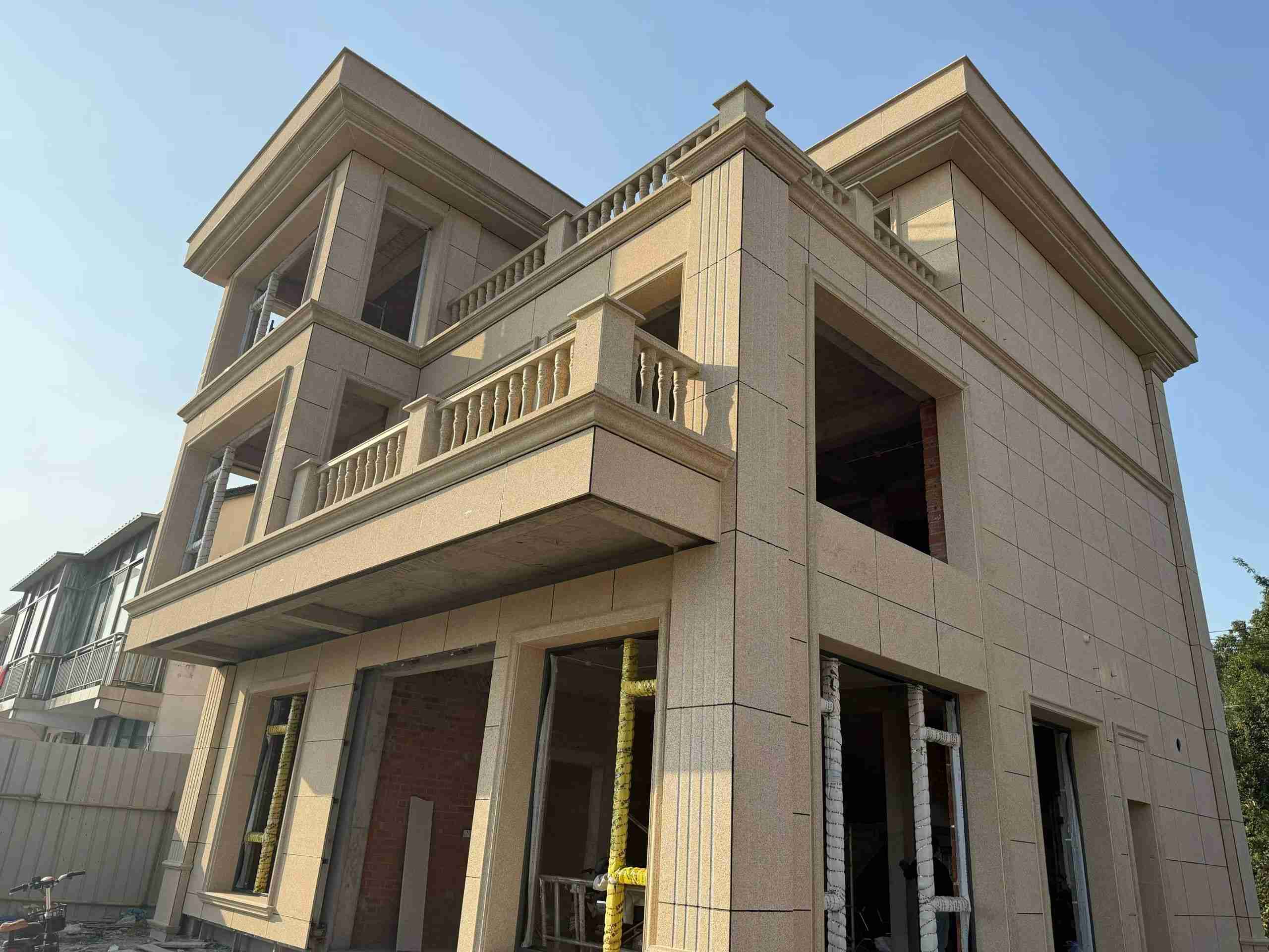 商丘 黄金麻花岗岩石材荔枝面外墙干挂效果展示